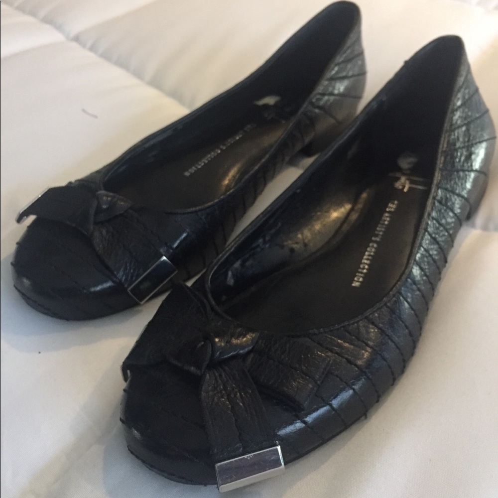 Black leather ballet flats with bow details